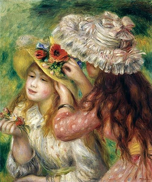 Girls putting flowers on their hats