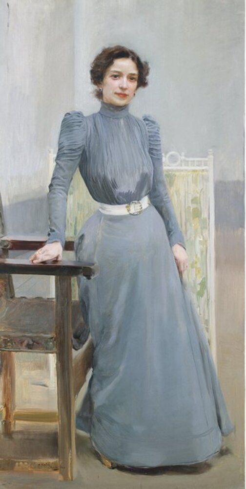 Clotilde in a grey dress