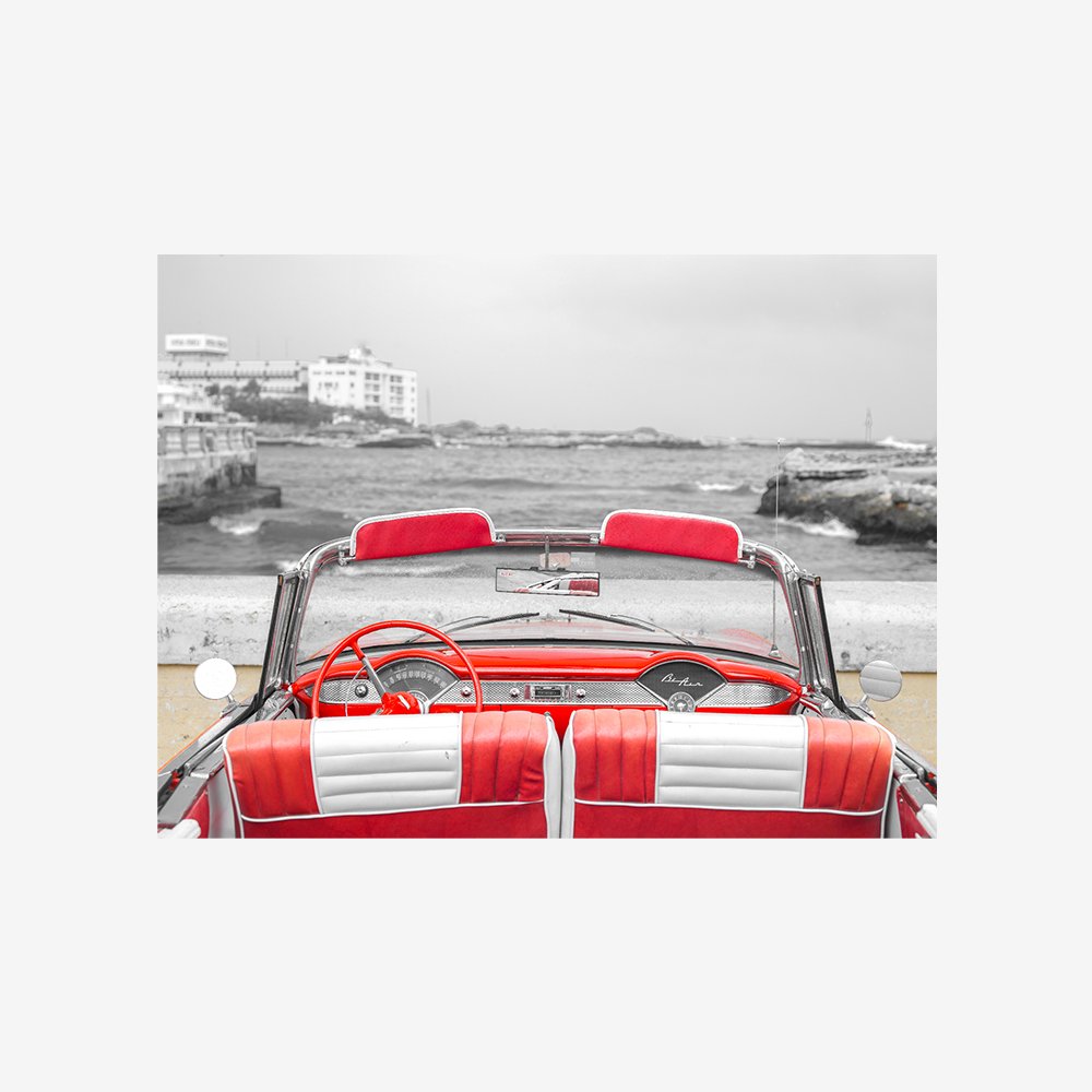 Vintage car near the beach in Cuba