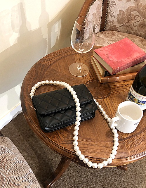 black quilting pearl bag